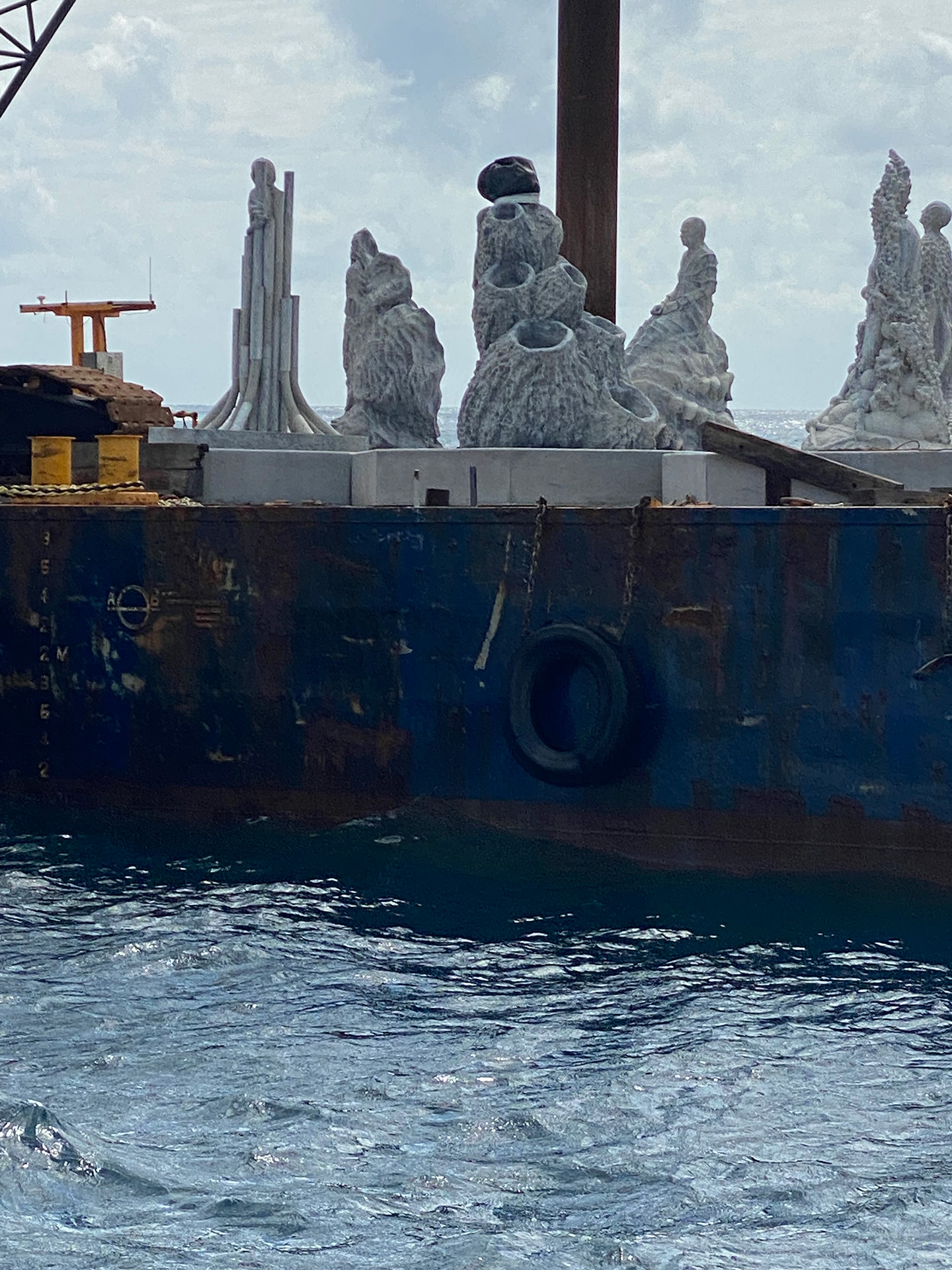 Statues being transported on a barge
