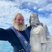 Dr. David Vaughan with statue